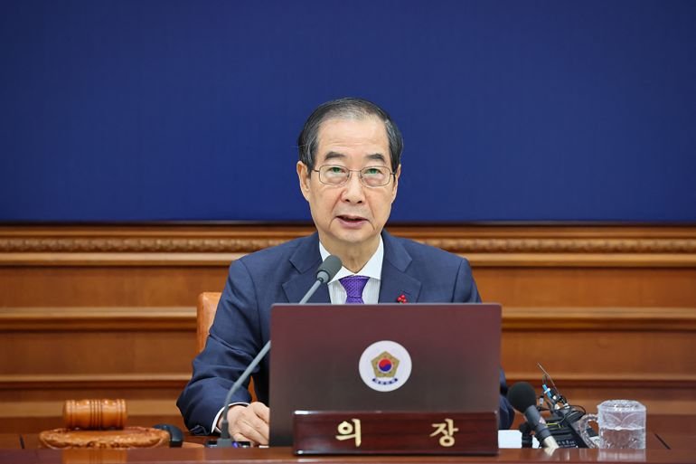 South Korean court reinstates impeached prime minister as acting president