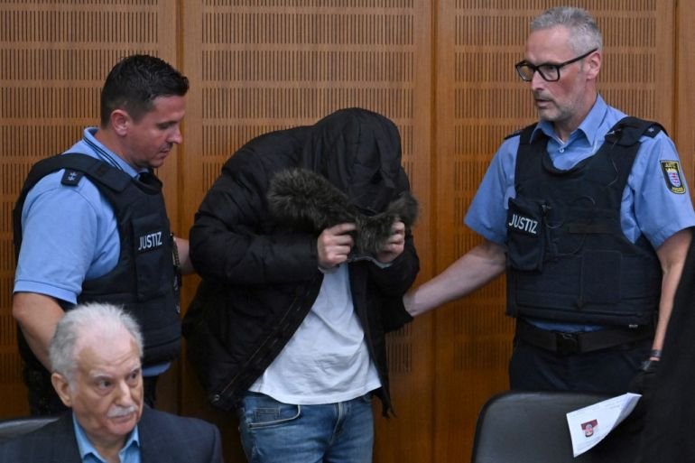 German court convicts Syrian doctor of…