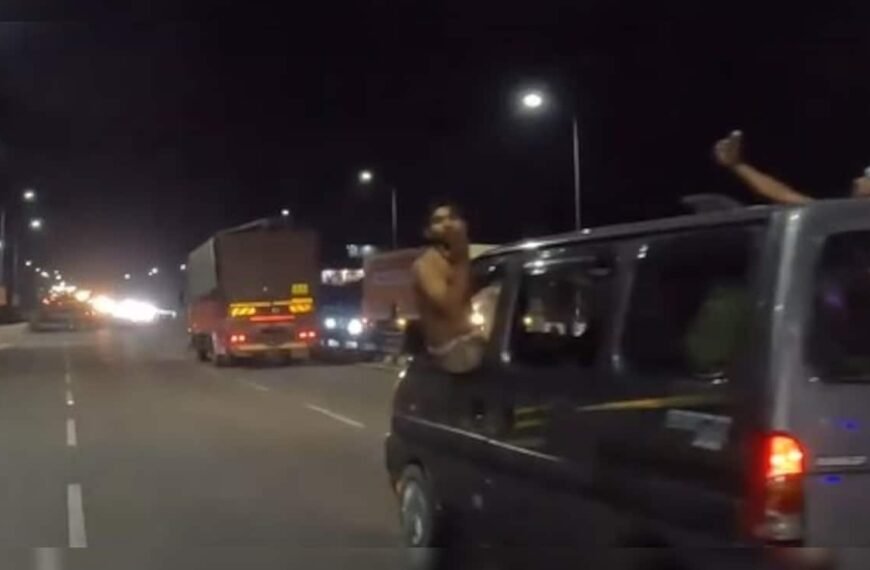 Video: Shirtless Men Hang Out Of…
