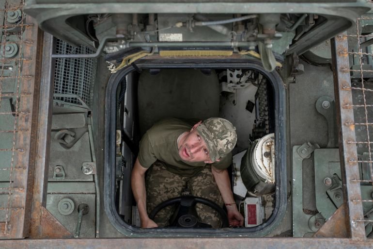Russia says it controls Luhansk as US halts some weapons pledged to Ukraine