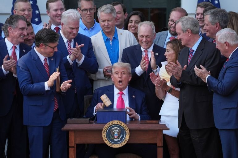 Trump claims victory as he signs…