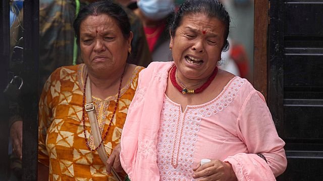 Families hold vigil in Nepal as…